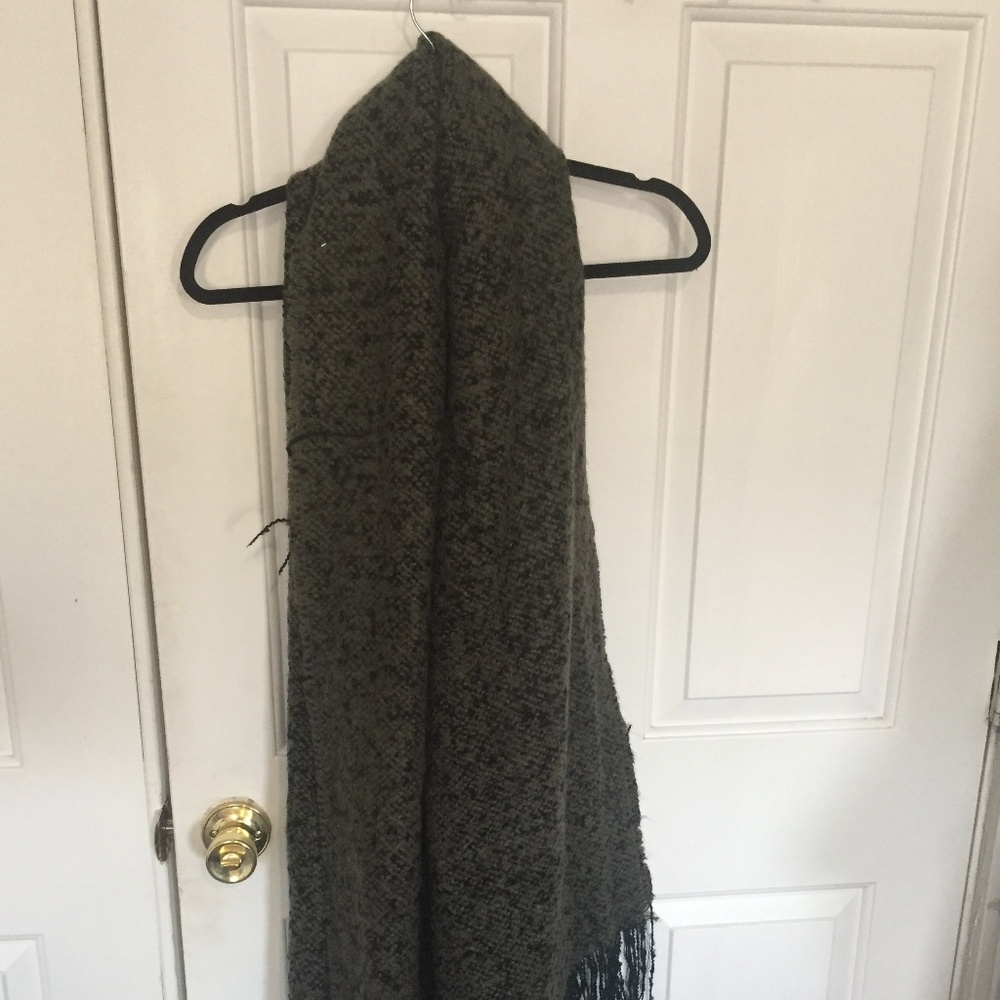 Warm and cozy knit scarf with frayed edges